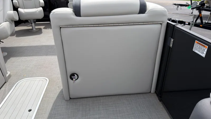Slide: The Image of The image shows the interior of a 2025 Starcraft EXS 3 FD TT boat with gray upholstery. - 23