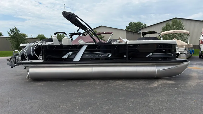 The Image of 2025 Starcraft EXS 3 FD TT pontoon boat parked on a lot. - 0