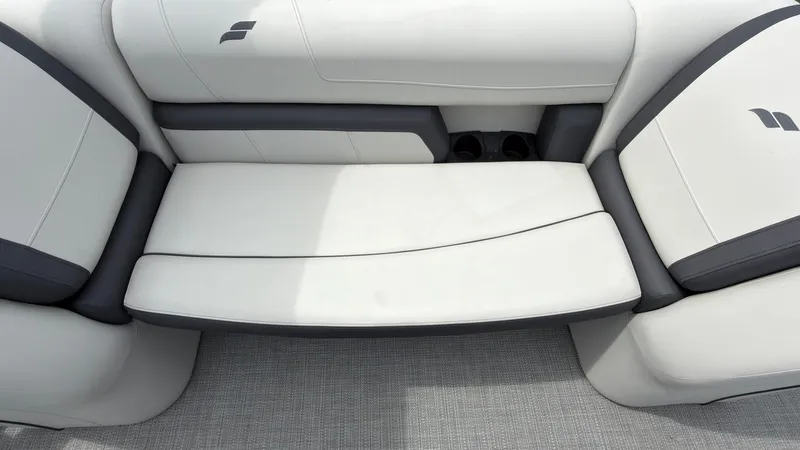 Slide: The Image of The 2025 Starcraft EXS 3 FD TT bench seat with white upholstery and gray accents. - 32