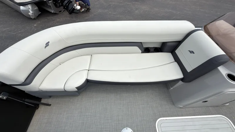 Slide: The Image of The image shows a white and gray seating area on a boat. - 17