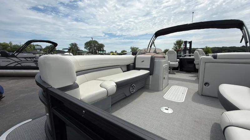 Slide: The Image of The image shows a modern pontoon boat with sleek white seating and an open deck. - 9