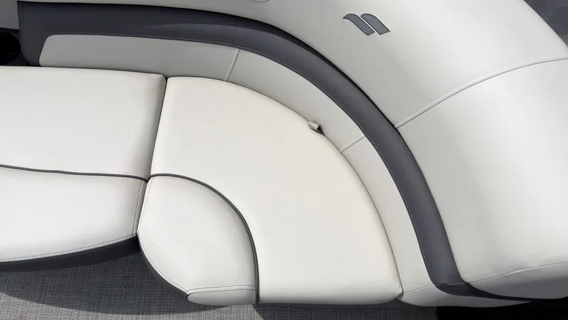 Slide: The Image of Close-up of the sleek, two-tone upholstery on a Starcraft EXS 3 FD TT boat. - 13