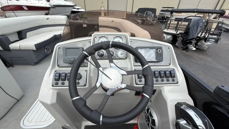 Slide: The Image of The image shows the cockpit of a 2025 Starcraft EXS 3 FD TT with modern instruments. - 39