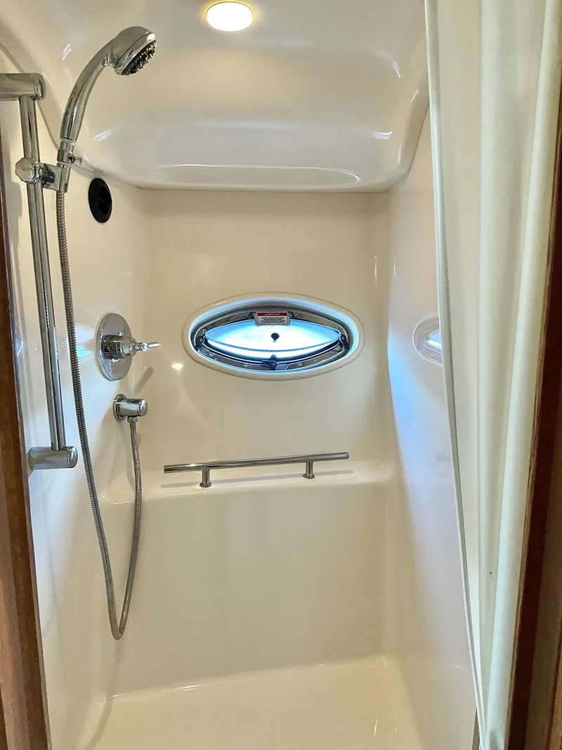 Slide: The Image of Shower area in 2007 Sea Ray 38 Sundancer yacht with porthole window. - 19