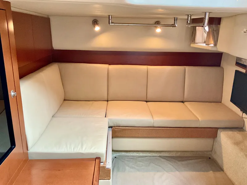 Slide: The Image of Luxurious interior of 2007 Sea Ray 38 Sundancer with beige seating and modern lighting. - 22