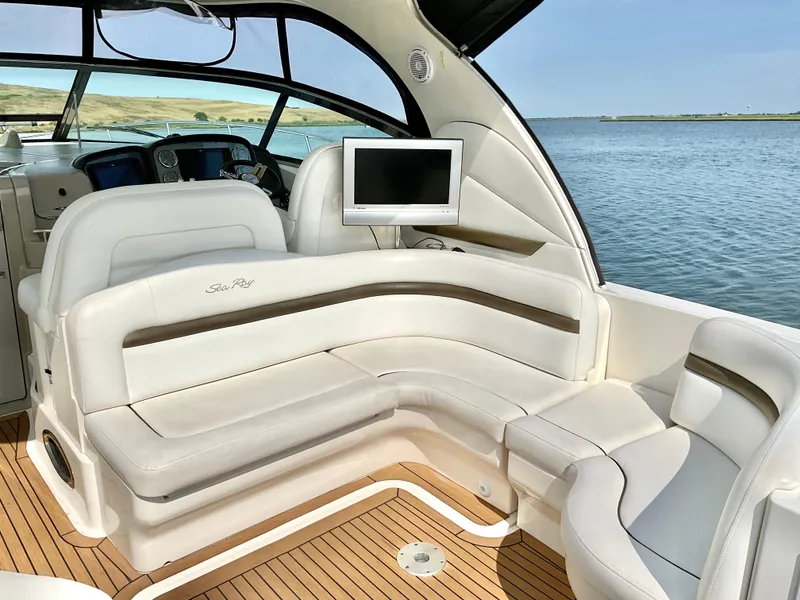 Slide: The Image of Luxurious 2007 Sea Ray 38 Sundancer yacht interior with plush seating and scenic water view. - 3
