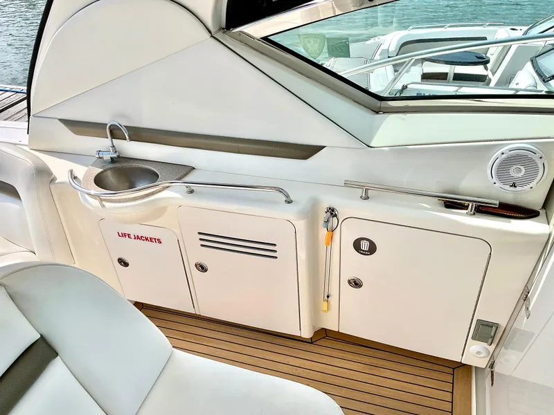 Slide: The Image of Interior of 2007 Sea Ray 38 Sundancer yacht with sink and storage cabinets. - 7