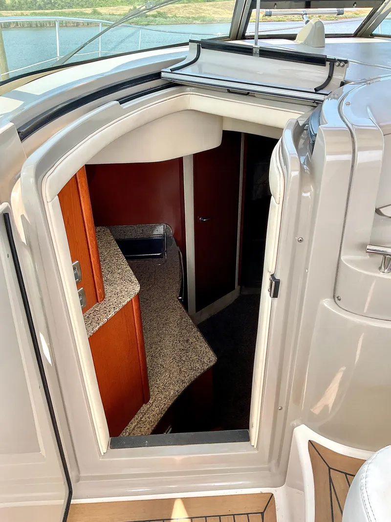 Slide: The Image of 2007 Sea Ray 38 Sundancer cabin entrance with sleek interior design. - 8