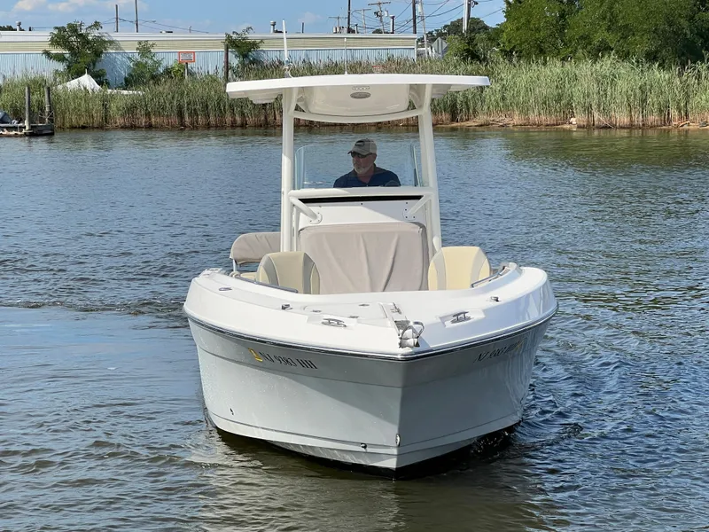 Slide: The Image of 2020 Century 2301 Center Console boat navigating calm waters. - 13