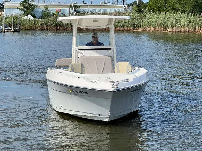 Slide: The Image of 2020 Century 2301 Center Console boat navigating calm waters. - 14