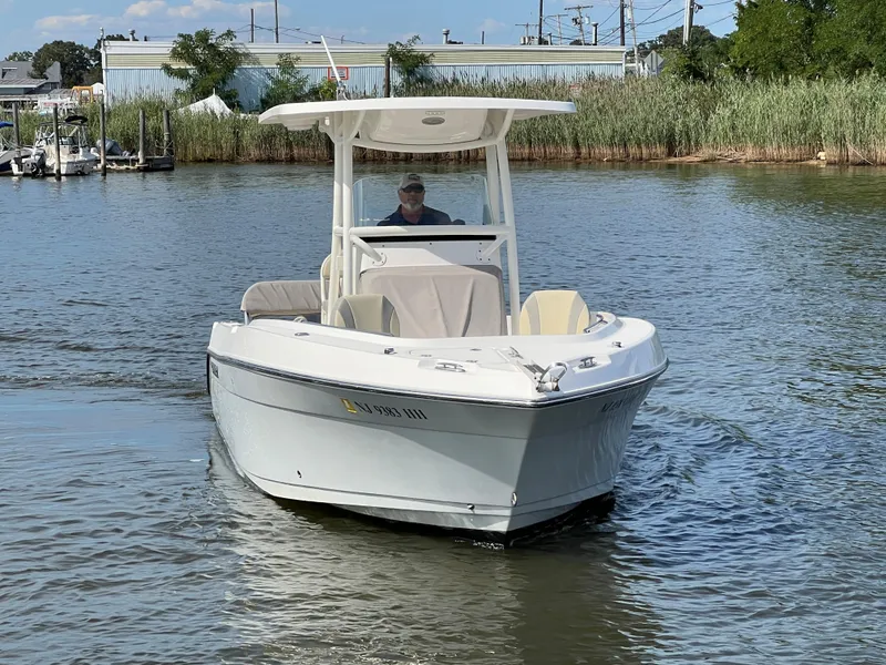 Slide: The Image of 2020 Century 2301 Center Console boat navigating calm waters. - 15