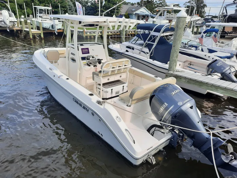 Slide: The Image of 2020 Century 2301 Center Console boat docked with Yamaha 300 engine. - 16
