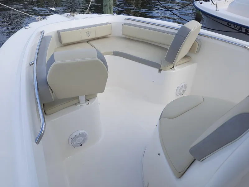 Slide: The Image of 2020 Century 2301 Center Console boat interior with cushioned seating and speakers. - 24