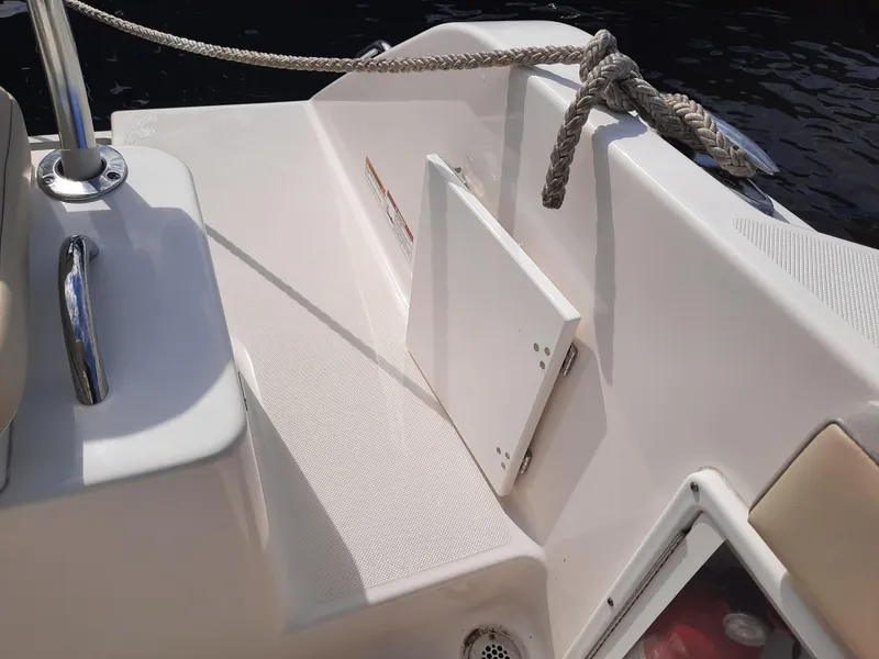 Slide: The Image of 2020 Century 2301 Center Console boat interior with seating and storage. - 27