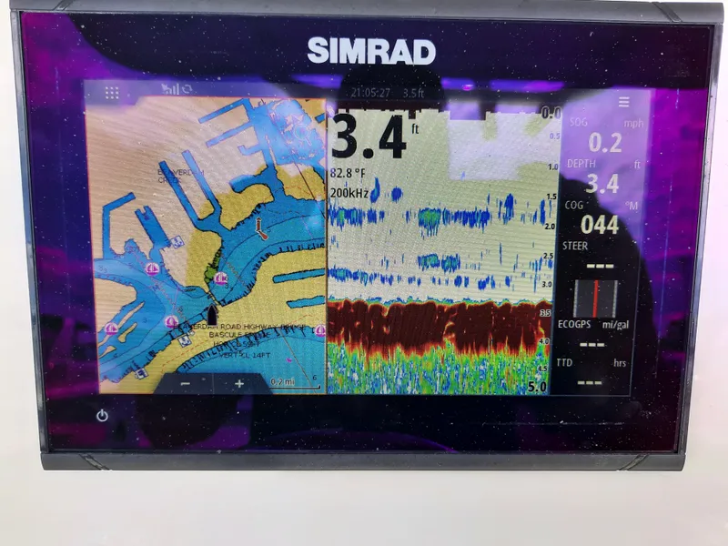 Slide: The Image of Simrad marine display showing navigation and sonar data on a Century 2301 Center Console, 2020 model. - 29
