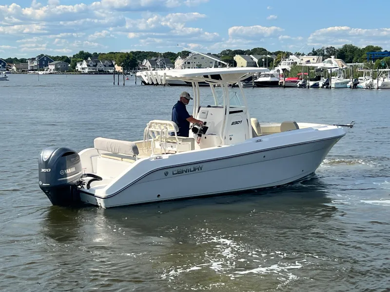 Slide: The Image of 2020 Century 2301 Center Console boat on water with Yamaha engine. - 3