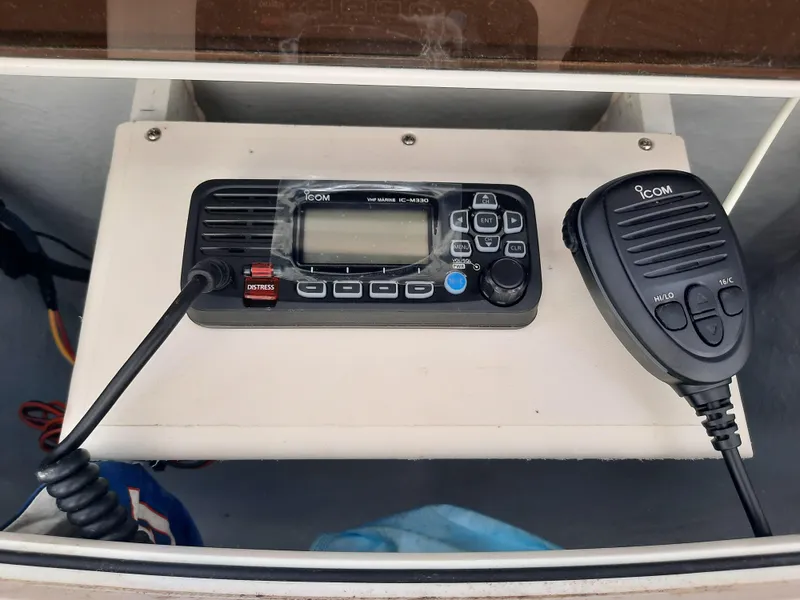 Slide: The Image of ICOM marine radio and microphone on a Century 2301 Center Console boat, 2020 model. - 30