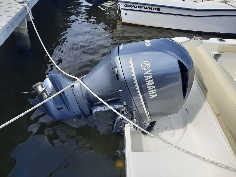 Slide: The Image of Yamaha outboard motor on 2020 Century 2301 Center Console boat, docked in marina. - 31