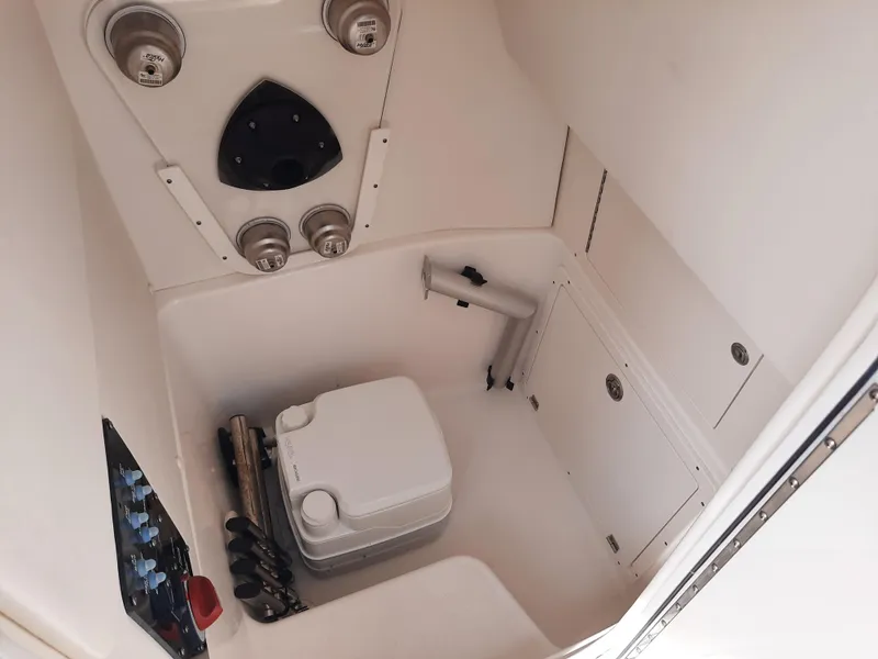 Slide: The Image of Interior of 2020 Century 2301 Center Console boat with storage and portable toilet. - 36