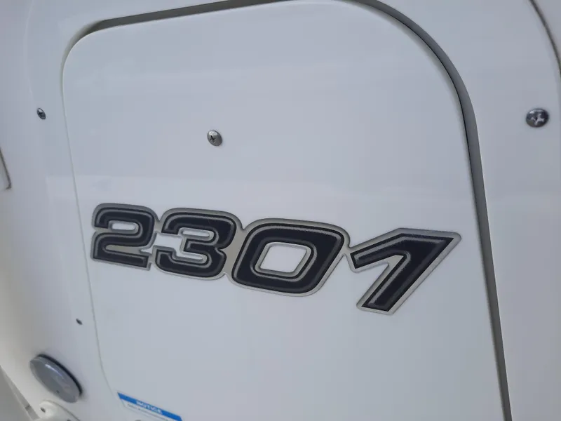Slide: The Image of Century 2301 Center Console 2020 model emblem on white surface. - 37