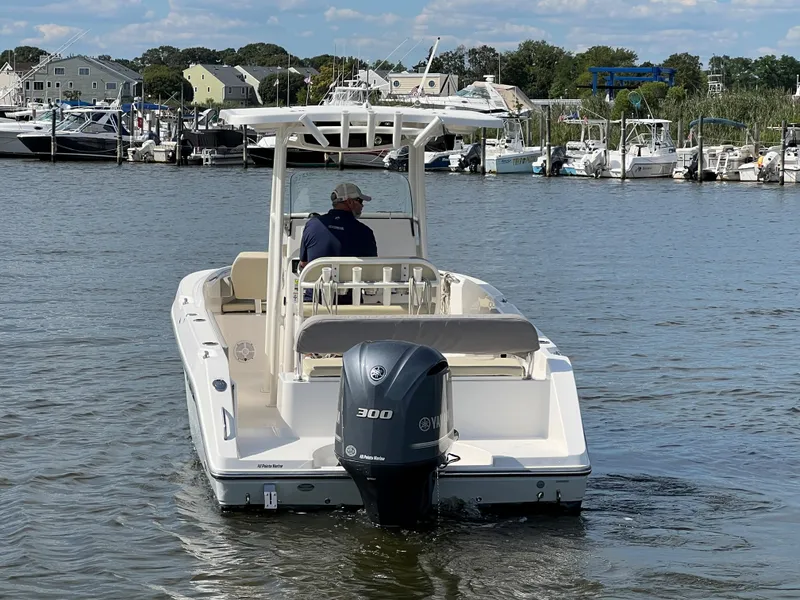 Slide: The Image of 2020 Century 2301 Center Console boat on water, rear view with outboard motor. - 5