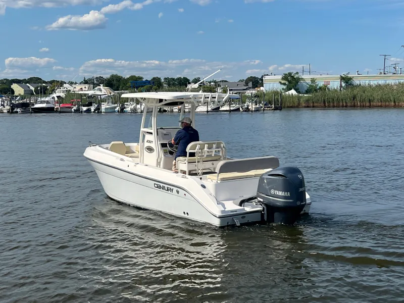 Slide: The Image of 2020 Century 2301 Center Console boat cruising on a calm river. - 6