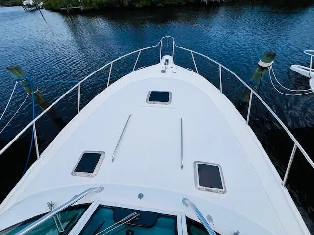 Slide: The Image of Tiara Yachts 3800 Open 2003 model, view from bow on calm water. - 28
