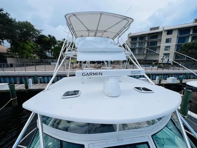 Slide: The Image of 2003 Tiara Yachts 3800 Open with Garmin radar, docked at marina. - 31