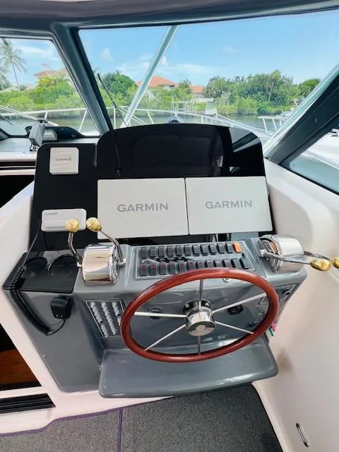 Slide: The Image of 2003 Tiara Yachts 3800 Open helm with Garmin navigation system and dual throttle controls. - 40