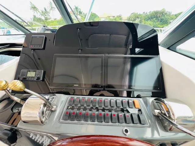 Slide: The Image of Control panel of 2003 Tiara Yachts 3800 Open with dual screens and navigation equipment. - 43
