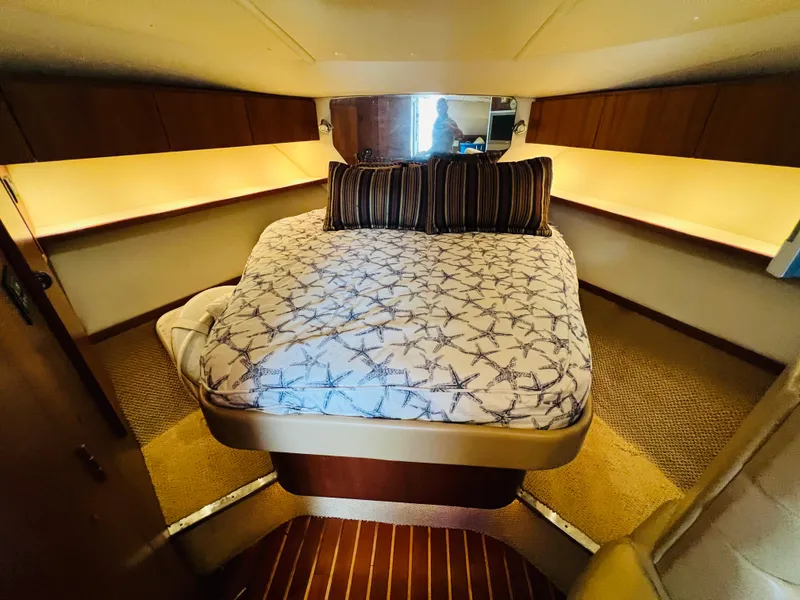 Slide: The Image of Luxurious cabin interior of 2003 Tiara Yachts 3800 Open with cozy bed and ambient lighting. - 44