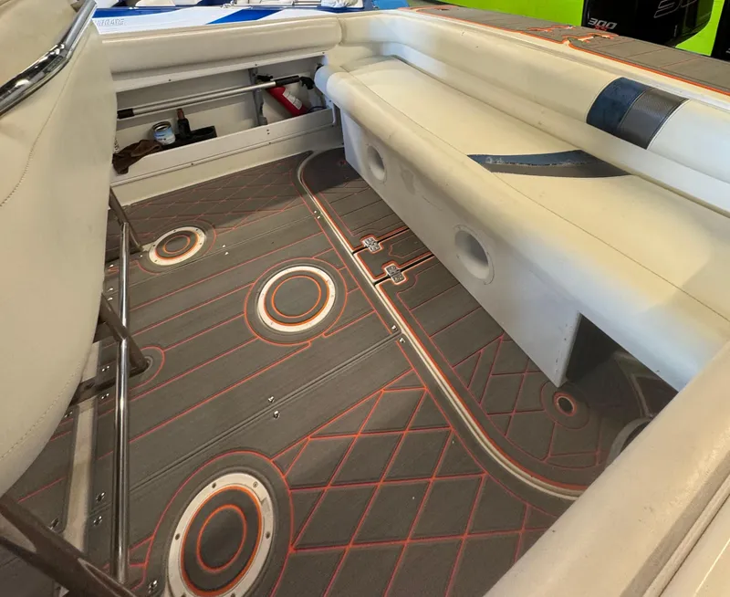 Slide: The Image of 1999 Wellcraft Scarab 302 boat interior with custom flooring and seating. - 11