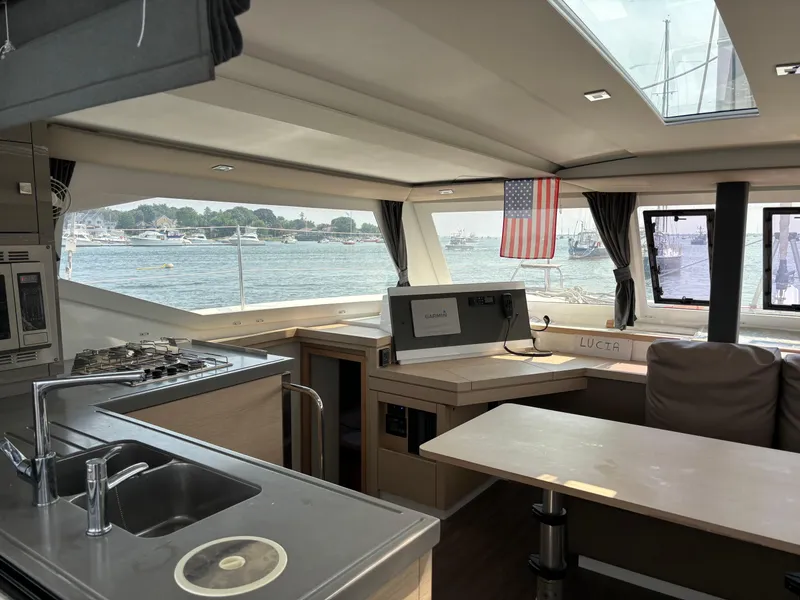 Slide: The Image of Interior of 2019 Fountaine Pajot Lucia 40 catamaran with kitchen and dining area. - 11