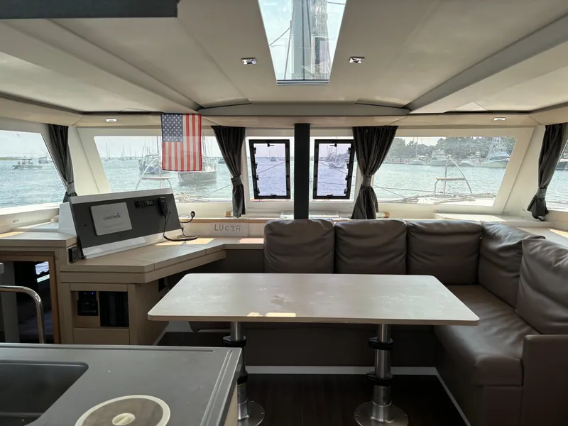 Slide: The Image of Interior of 2019 Fountaine Pajot Lucia 40 catamaran with spacious seating and ocean view. - 12