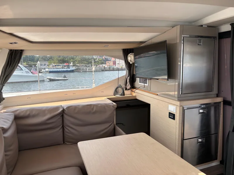 Slide: The Image of Interior of 2019 Fountaine Pajot Lucia 40 catamaran with modern kitchen and seating area. - 13