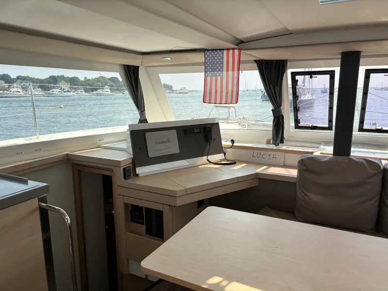 Slide: The Image of Interior of 2019 Fountaine Pajot Lucia 40 catamaran with scenic marina view. - 16