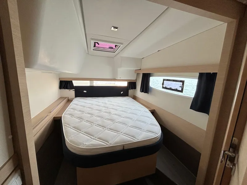 Slide: The Image of Interior cabin of 2019 Fountaine Pajot Lucia 40 catamaran with bed and windows. - 19