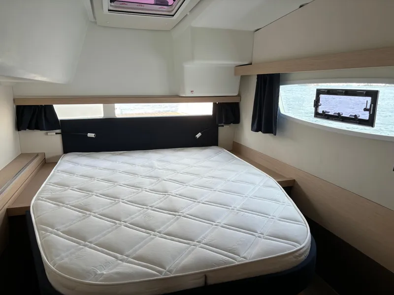 Slide: The Image of Cabin interior of 2019 Fountaine Pajot Lucia 40 catamaran with a spacious bed. - 20