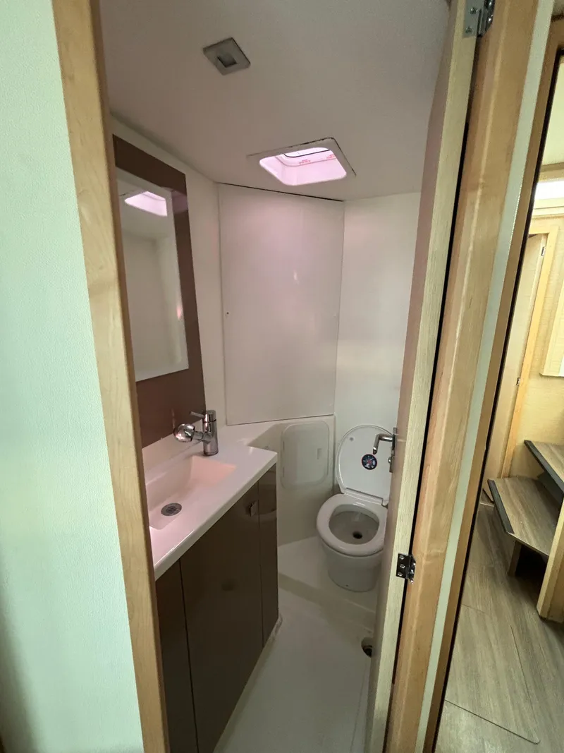 Slide: The Image of Modern bathroom in 2019 Fountaine Pajot Lucia 40 catamaran, featuring sleek fixtures and compact design. - 21