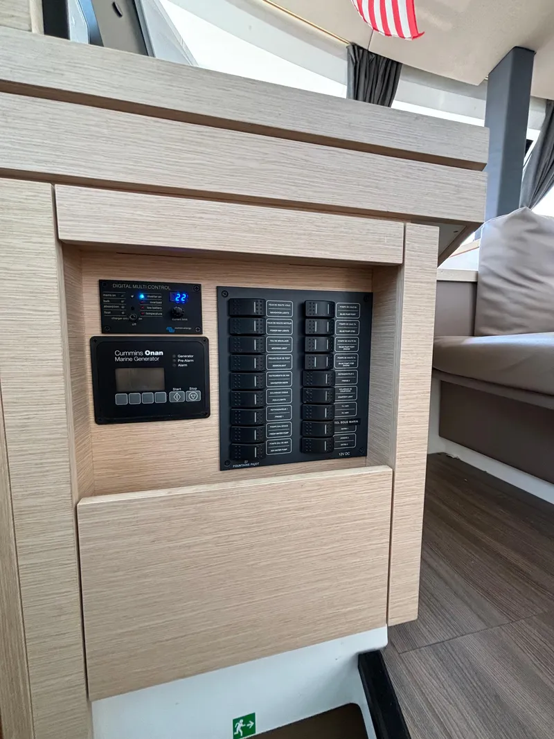Slide: The Image of Control panel inside 2019 Fountaine Pajot Lucia 40 catamaran, featuring modern design and seating area. - 23