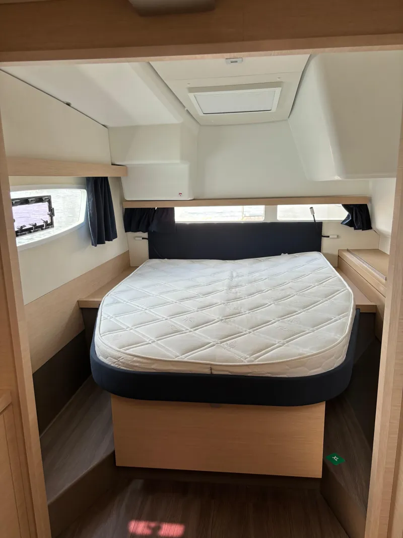 Slide: The Image of 2019 Fountaine Pajot Lucia 40 cabin interior with bed and modern design. - 25