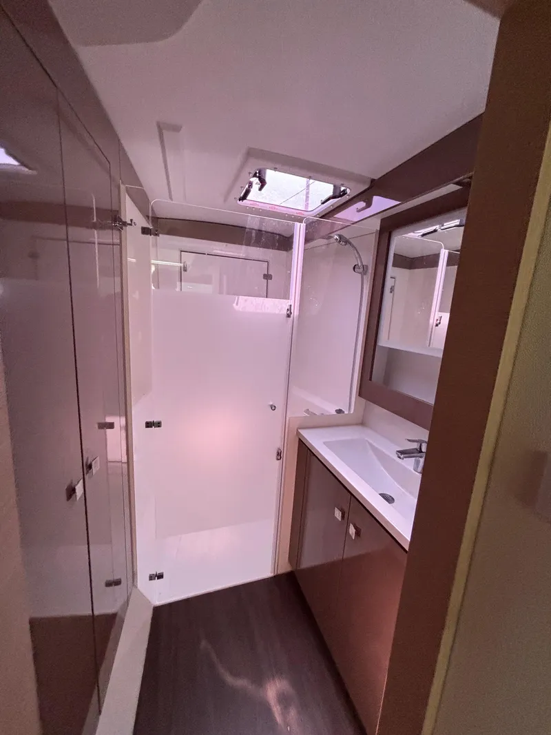 Slide: The Image of Modern bathroom in 2019 Fountaine Pajot Lucia 40 catamaran with sleek design and ample lighting. - 27