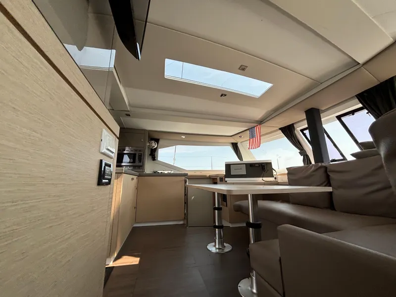 Slide: The Image of Interior of 2019 Fountaine Pajot Lucia 40 catamaran with modern seating and skylight. - 32