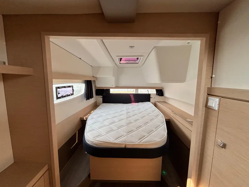 Slide: The Image of Interior cabin of 2019 Fountaine Pajot Lucia 40 catamaran with bed and windows. - 33