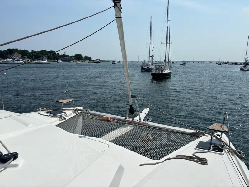 Slide: The Image of Fountaine Pajot Lucia 40 catamaran sailing in a serene harbor, 2019 model. - 43