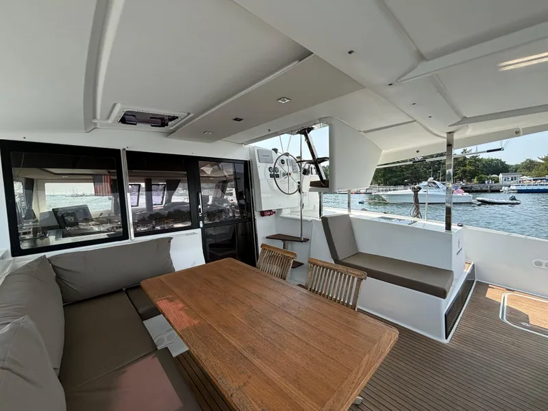 Slide: The Image of Spacious 2019 Fountaine Pajot Lucia 40 catamaran interior with seating and dining area. - 49