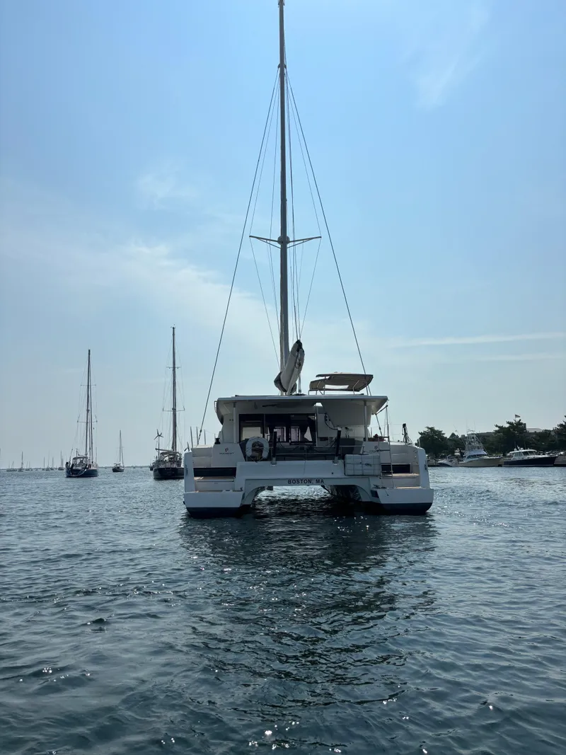 Slide: The Image of 2019 Fountaine Pajot Lucia 40 catamaran sailing on calm waters. - 8