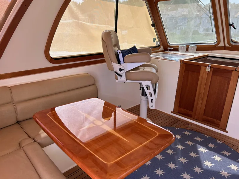 Slide: The Image of Interior of 2009 Sabre Hardtop Express with leather seating and wooden table. - 15
