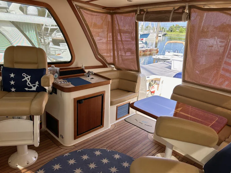 Slide: The Image of Interior of 2009 Sabre Hardtop Express yacht with elegant seating and nautical decor. - 17