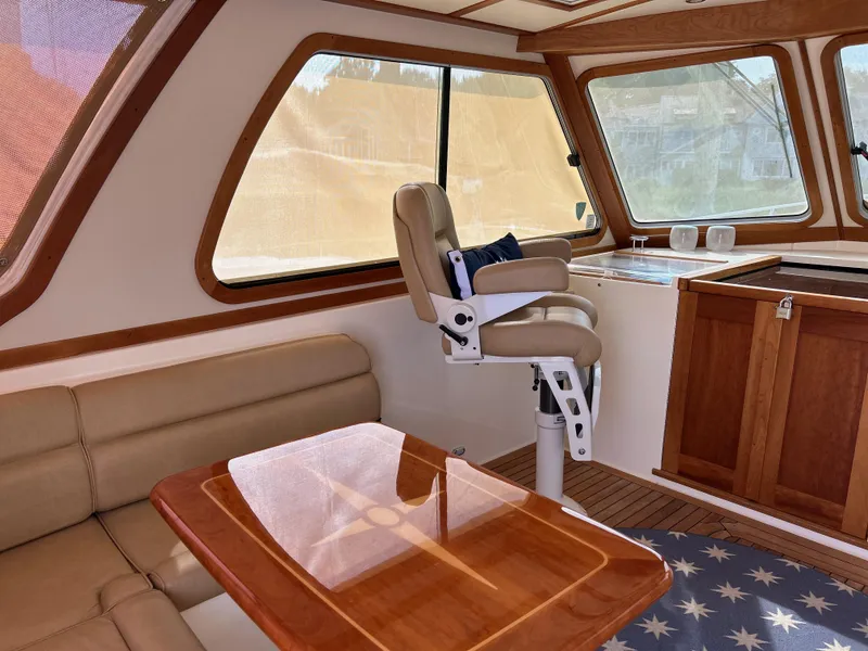 Slide: The Image of Interior of 2009 Sabre Hardtop Express with leather seating and wooden accents. - 19